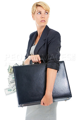 Buy stock photo A young businesswoman looking around while holding a briefcase of cash