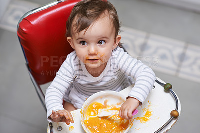 Buy stock photo Child eating, high chair and food, nutrition and health for childhood development and wellness. Healthy, growth and toddler person at home, vegetable or fruit, hungry baby with lunch or dinner meal