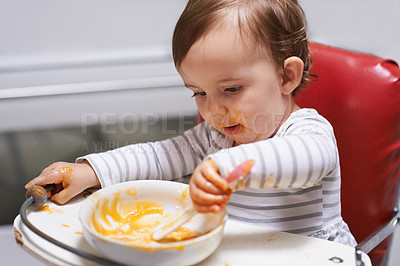 Buy stock photo Kid eating, high chair and food, nutrition and health for childhood development and wellness. Healthy, growth and toddler person at home, vegetable or fruit, hungry baby with lunch or dinner meal