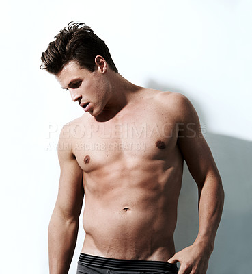 Buy stock photo Handsome, sexy and body of man in a studio for bodybuilding exercise, workout or training. Young, hot and shirtless muscular male model person with confidence isolated by white studio background.