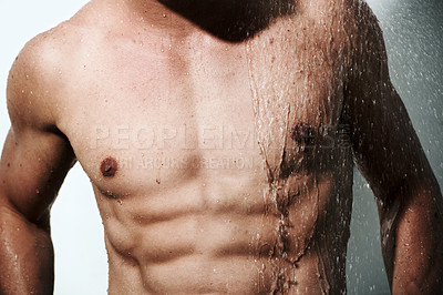 Buy stock photo Closeup, muscular man or wet with body, hygiene or fitness with abs, routine or wellness on studio background. Person, guy or model with water, bodybuilder or cleaning with energy, chest or aesthetic