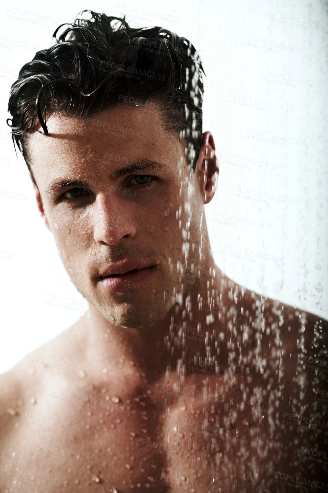 Buy stock photo Portrait of man in shower, cleaning body and grooming for morning wellness, hygiene and skin routine. Relax, skincare and face of male model with muscle washing in water, self care and calm bathroom.