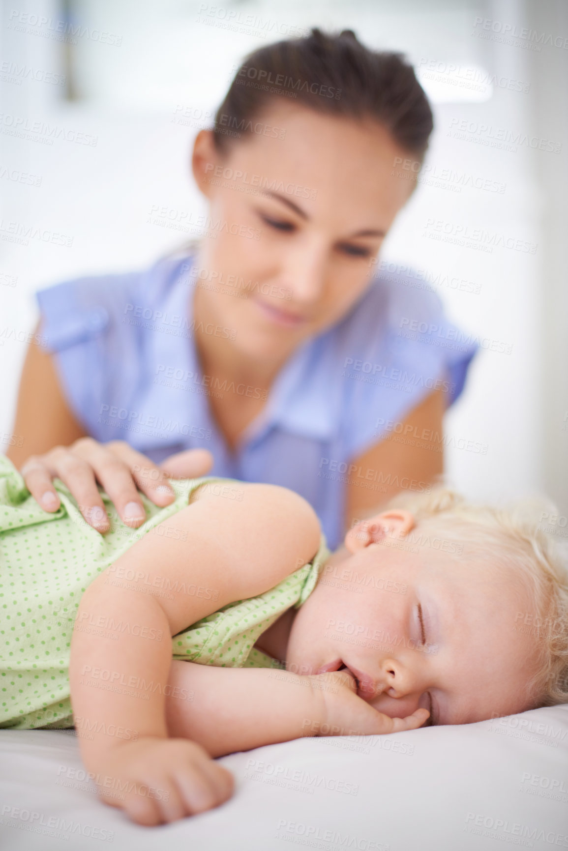 Buy stock photo Sweet, sleeping and mother with baby on bed for bonding, relax and happy cute relationship. Love, smile and young mom watching girl child, kid or toddler taking a nap in bedroom or nursery at home.