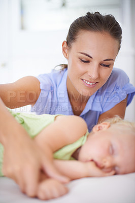 Buy stock photo Love, sleeping and mother with baby on bed for bonding, relax and sweet cute relationship. Happy, smile and young mom watching girl child, kid or toddler taking a nap in bedroom or nursery at home.