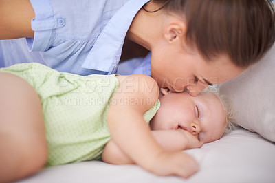 Buy stock photo Kiss, sleeping and mother with baby on bed for bonding, relax and sweet cute relationship. Happy, smile and young mom watching girl child, kid or toddler taking a nap in bedroom or nursery at home.