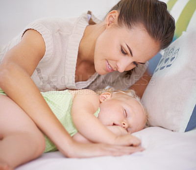 Buy stock photo Smile, sleeping and mother with baby on bed for bonding, relax and sweet cute relationship. Happy, love and young mom watching girl child, kid or toddler taking a nap in bedroom or nursery at home.