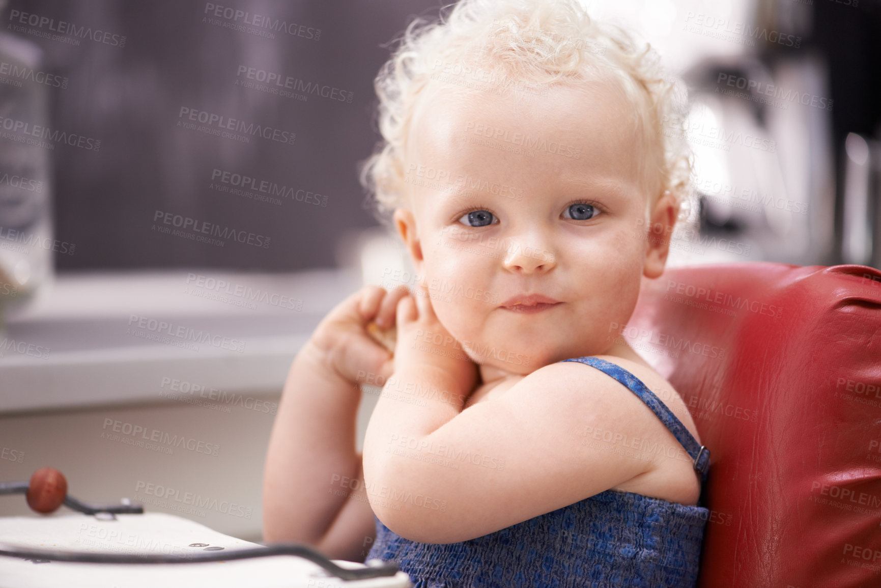 Buy stock photo Portrait, baby and child on a high chair in kitchen at home alone, healthy and adorable. Face, toddler and cute blonde kid or young child in development, growth and innocent in Switzerland in house