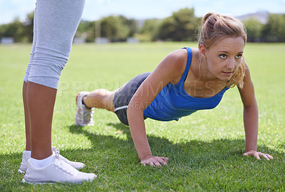 Buy stock photo Women, face and push ups on grass for exercise with fitness, training and workout on sports field. Athlete, person and confidence on ground and coach or physical activity for healthy body or wellness