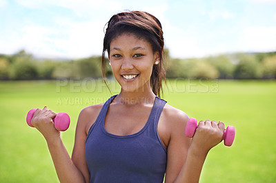 Buy stock photo Woman, portrait and dumbbells outdoor for workout with smile for exercise, training or fitness on sports field. Athlete, person and happy for weightlifting or healthy body on grass with equipment