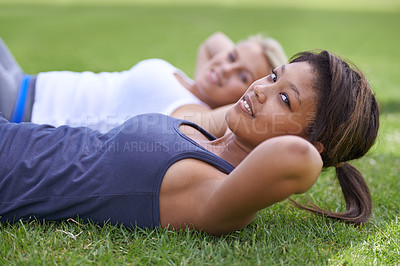 Buy stock photo Happy woman, portrait and sit ups for outdoor exercise or workout in fitness together on green grass. Young active female person or people smile for training, health and wellness on field in nature