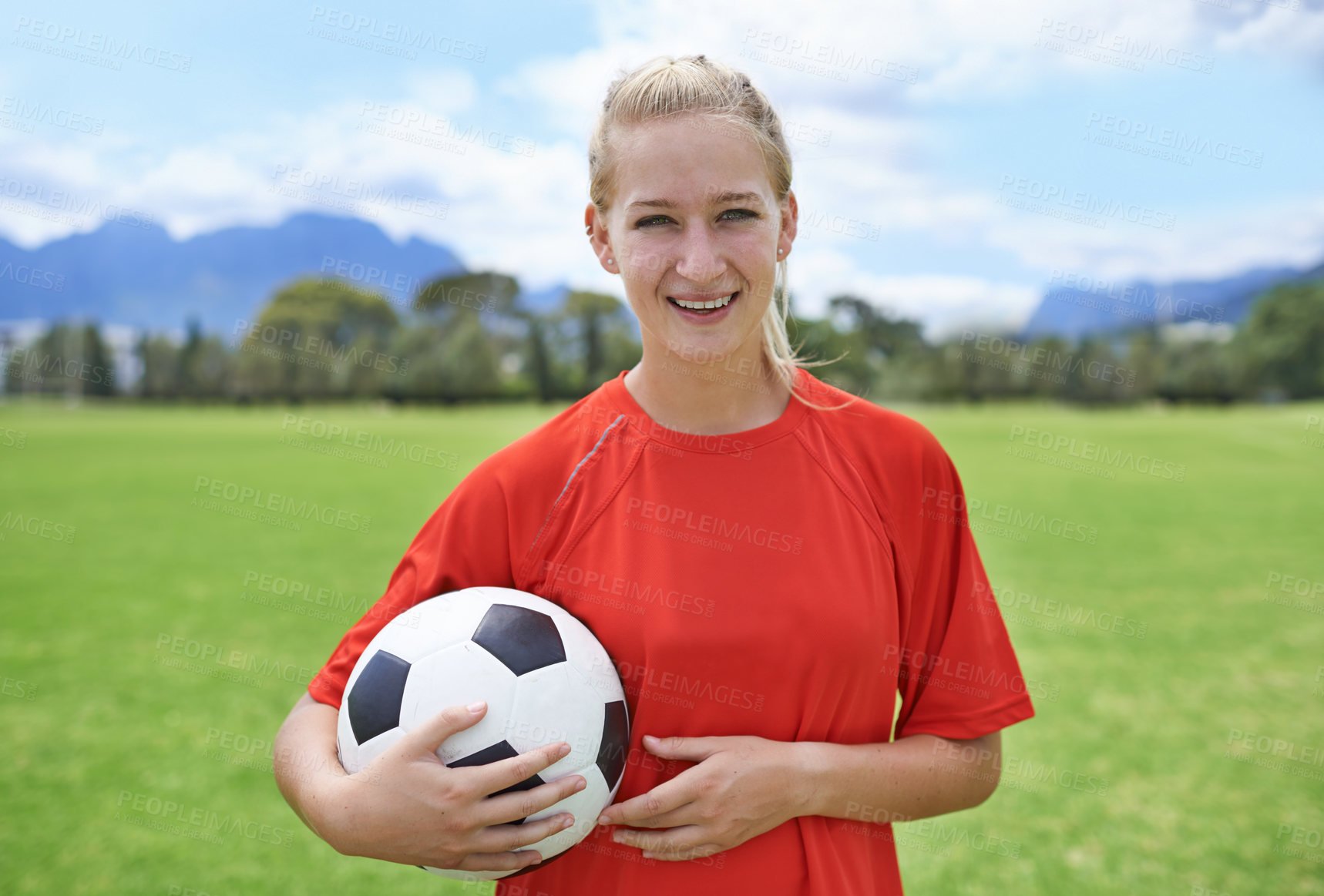 Buy stock photo Woman, field and portrait with soccer ball, happy and football pitch for match, competition or game. Fitness, practice and ready for training, outdoor and exercise for athlete, strong and sport