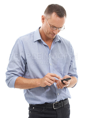 Buy stock photo Phone, typing and business man in studio isolated on a white background for social media. Technology, smartphone and mature male entrepreneur with mobile cellphone for internet browsing or scrolling.