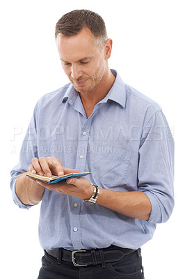 Buy stock photo Notebook, schedule and agenda with a man in studio isolated on a white background reading notes. Book, note and planner with a handsome mature male on blank space checking his journal or diary