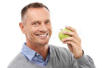 Buy stock photo Man, studio portrait and eating apple fruit for health, diet and wellness isolated on a white background. Model person with nutrition vegan food for a healthy lifestyle, motivation and happiness