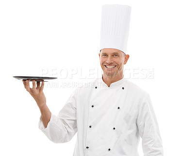Buy stock photo Chef holding tray, confident portrait and smile presenting promo or restaurant product placement isolated on white background Happy executive cook man in uniform, mock up and menu launch in studio.