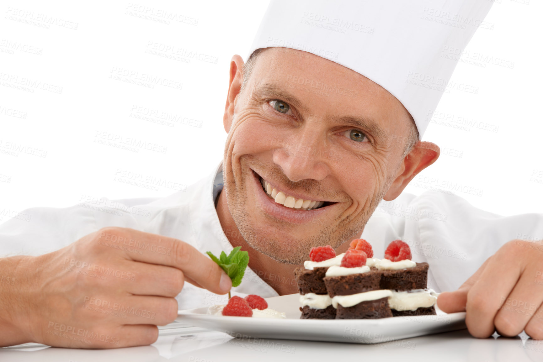 Buy stock photo Bakery, baking and portrait of a chef with cake presentation isolated on a white background in a studio. Fruit, food and face of a professional baker with a sweet chocolate dessert for catering