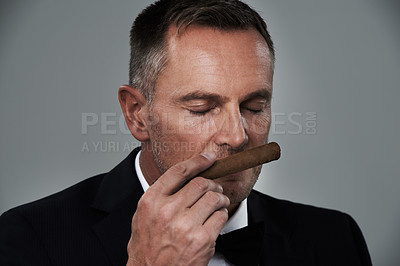 Buy stock photo Wealth, vintage and face of man with cigars for smoking habit on gray background for luxury, power and success. Retirement, business gangster and senior male smell tobacco smoke for rich lifestyle