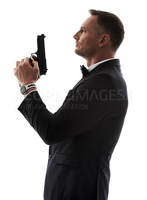 Buy stock photo Spy man, profile and gun with suit for undercover mission, justice or espionage by white background. Government agent, detective and weapon in studio with designer tuxedo, secret information and work