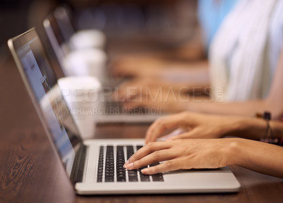 Buy stock photo Cropped image of people's hands working on laptops