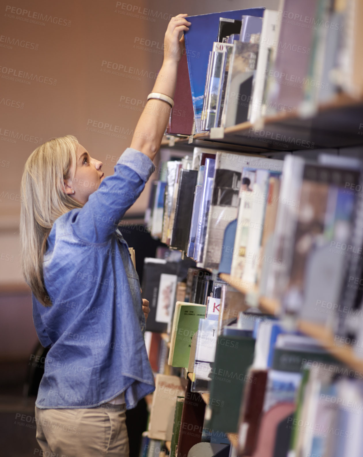 Buy stock photo Student woman, library and search bookshelf for studying, learning and scholarship with development at campus. Girl, research and books on shelf for information, knowledge and thinking at university