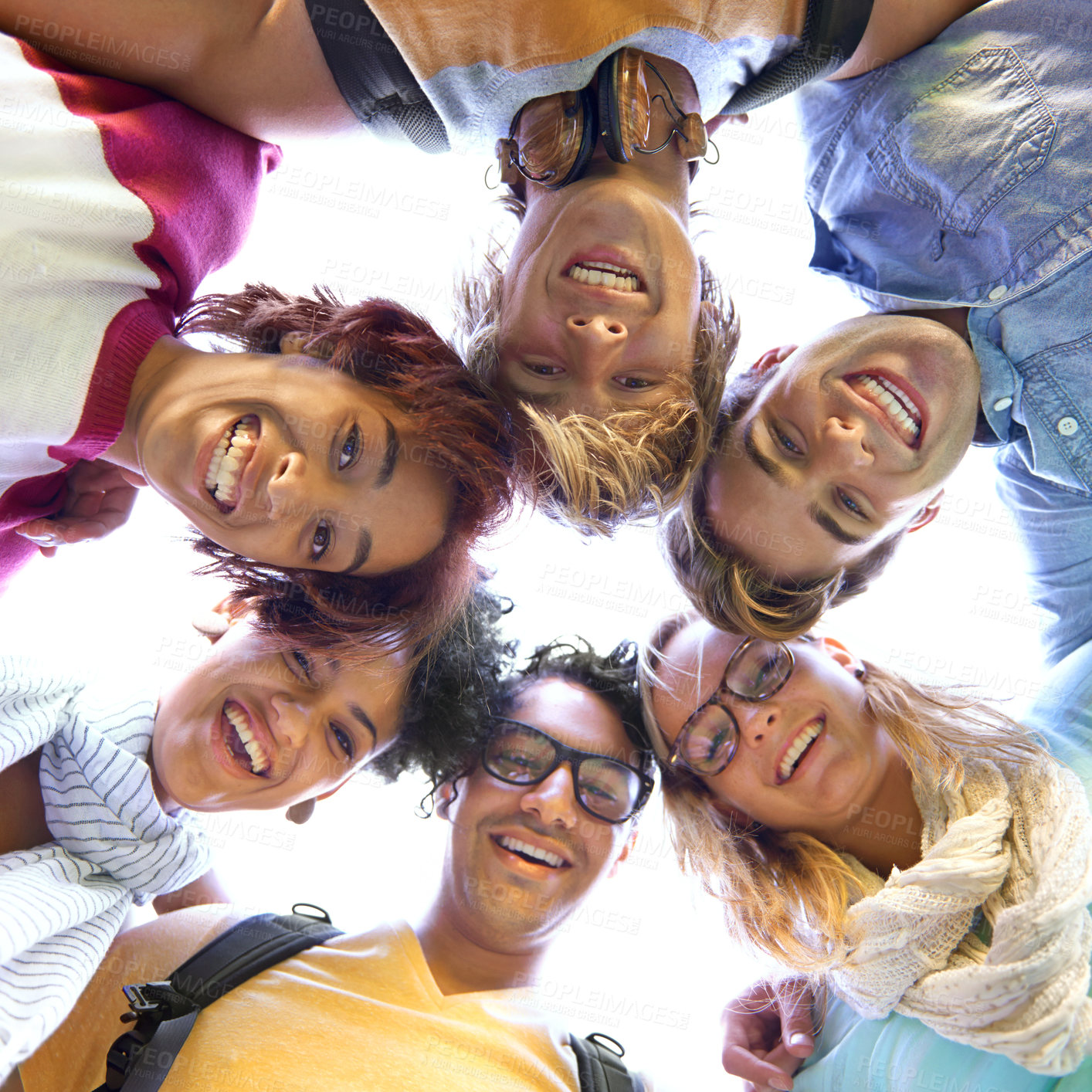 Buy stock photo Low angle portrait of a group of students in a huddle