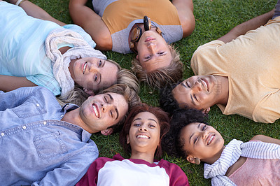 Buy stock photo Top view, friends and portrait of group on grass at park on vacation, holiday or summer travel. Above, smile and face of students on lawn, relax in nature and freedom of community together in circle