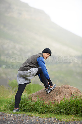 Buy stock photo Fitness, stretching and portrait of a man in nature for training, running and a workout. Health, start and a male runner or athlete with a warm up in the road for a competition, cardio or exercise