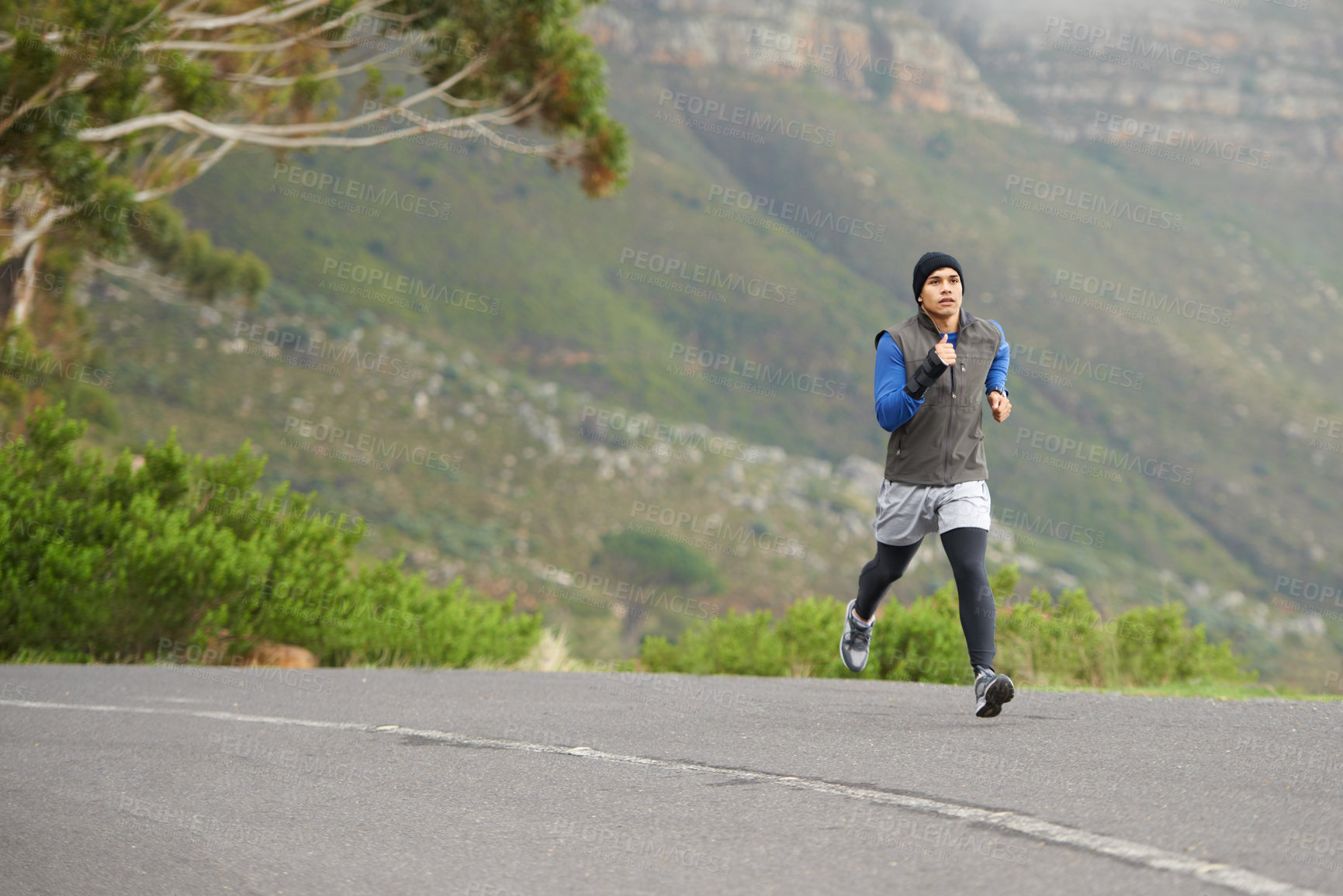 Buy stock photo Fitness, exercise and a man in the street for running, training and marathon competition. Health, energy and a male runner or athlete in the road for sports, morning cardio or a workout in nature