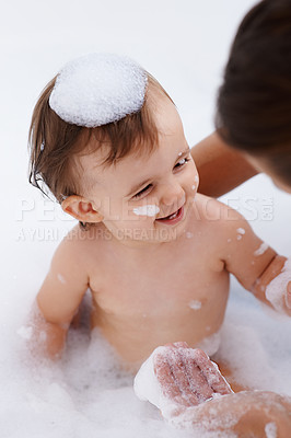 Buy stock photo Baby, person and laughing while washing in bath, foam soap and cleaning for skincare at home. Happy girl, toddler and childcare or water for prevention of bacteria and virus, cosmetics and liquid