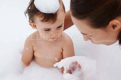 Buy stock photo Cropped shot of a little baby girl with her mother