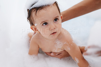 Buy stock photo Baby, water and soap for washing in bathroom, bath and cleaning for skincare at home. Person, toddler and childcare or hygiene for prevention of bacteria and virus, cosmetics and liquid for care