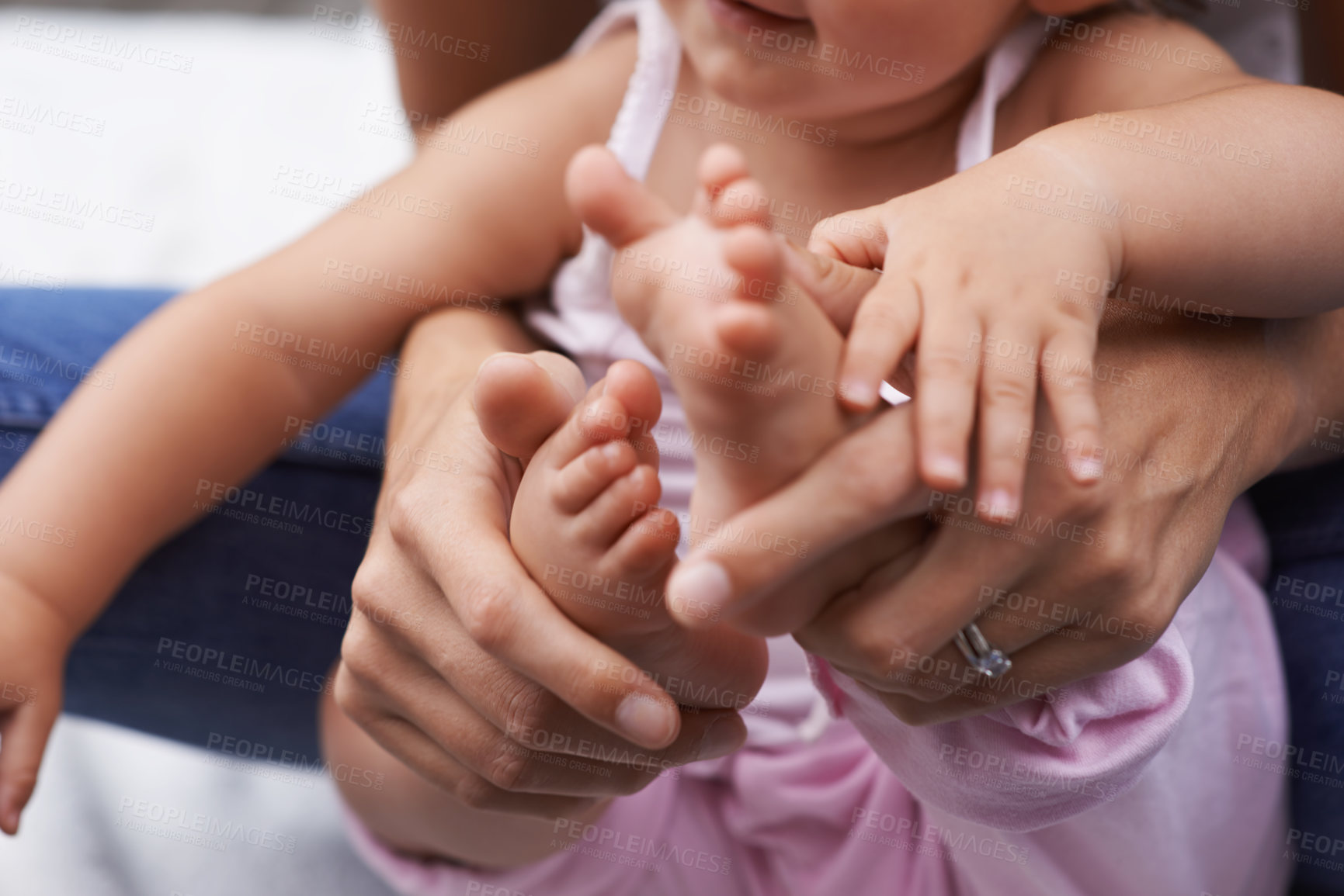Buy stock photo Baby, feet and mom hands with love, bonding and child care with parenting and youth outdoor. Family, support and young kid with newborn, holding and barefoot with trust, toddler and relax with mother