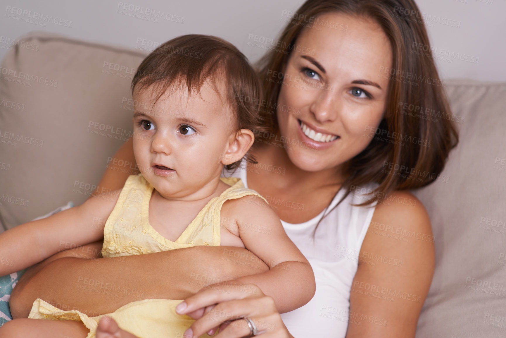 Buy stock photo Mother, baby and hug in living room for love, smile and affection or bonding in childhood. Mom, toddler and happy girl or child and relaxing on couch, embrace and security in relationship and care