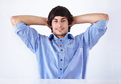Buy stock photo Happy man, portrait and relax at office on break for done, completion or finished on a white studio background. Face of young handsome male person or employee in rest with blue clothing or fashion
