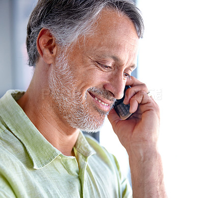Buy stock photo Thinking, smile or mature man on a phone call listening or talking for communication to relax. Confident, retirement or senior person in home calling to chat in conversation or speaking on mobile
