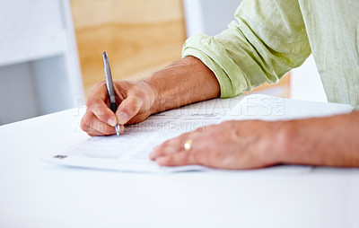 Buy stock photo Cropped shot of a businessman signing contracts