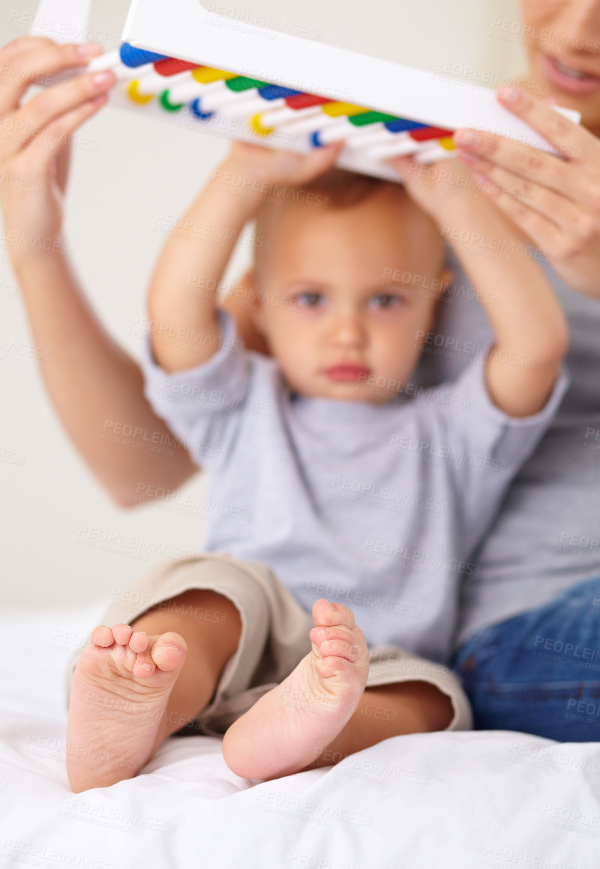 Buy stock photo Abacus, portrait and baby with mother playing, learning and teaching for child development on bed. Bonding, toy and mom teaching kid, infant or toddler math counting in bedroom at modern home.