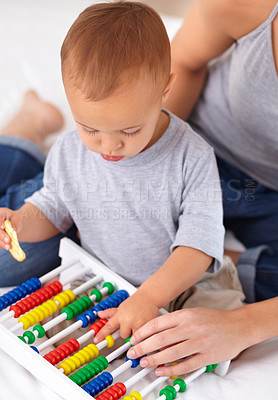 Buy stock photo Abacus, toy and baby with mother playing, learning and teaching for child development on bed. Math, bonding and closeup of mom helping kid, infant or toddler with counting in bedroom at home.