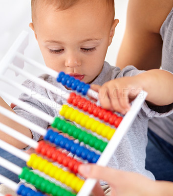 Buy stock photo Abacus, math and baby with mom playing, learning and teaching for child development on bed. Bonding, toy and closeup of mother teaching kid, infant or toddler with counting in bedroom at home.