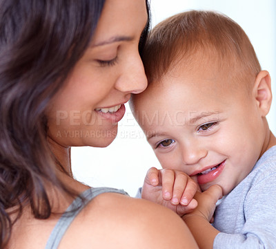 Buy stock photo White background, happy and face of mother with baby for bonding, relationship and relax together. Family, youth and closeup of mom carrying kid for growth, love and child development in studio