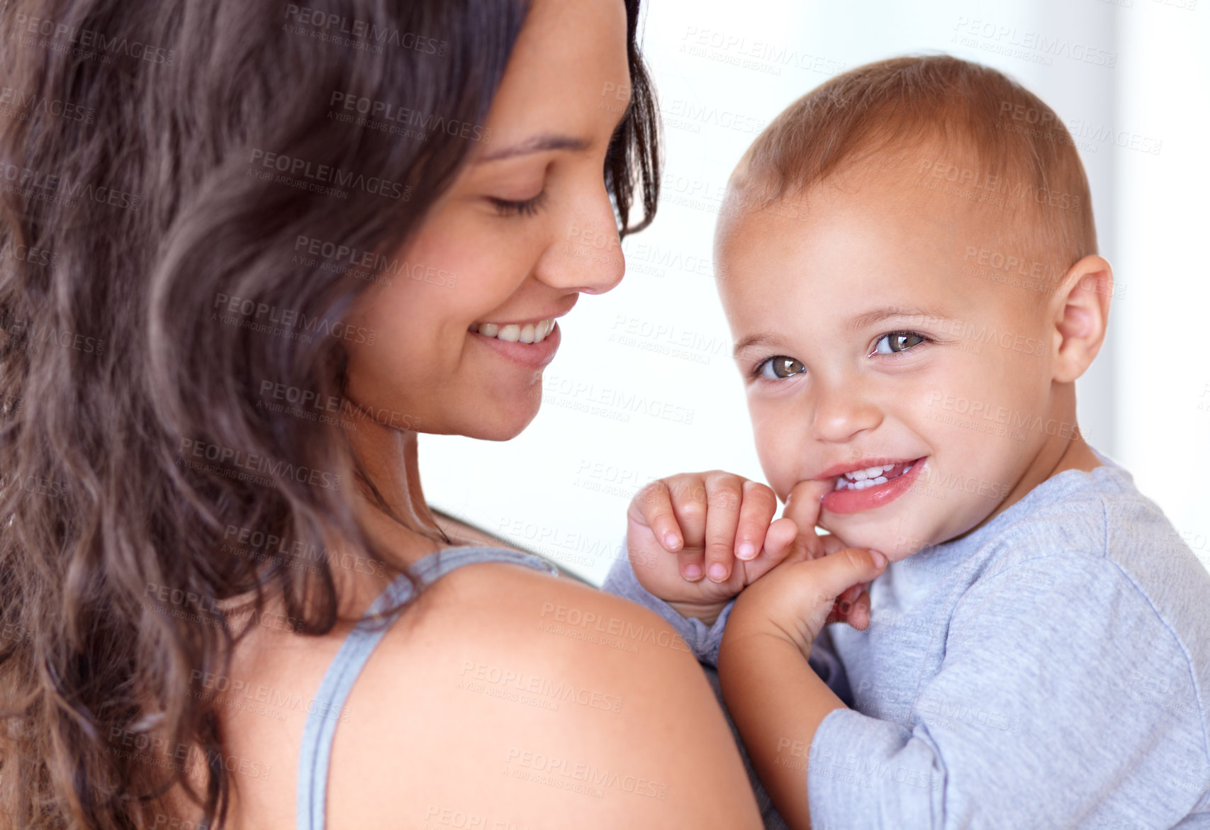 Buy stock photo Cropped image of a mother holding her little boy