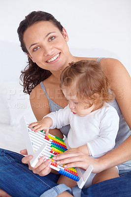 Buy stock photo Smile, portrait and baby with mother on abacus playing, learning and teaching for child development on bed. Bonding, toy and mom with kid, infant or toddler with counting in bedroom at home.