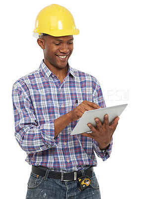Buy stock photo Studio portrait of an african american man in construction clothing working with a digital tablet