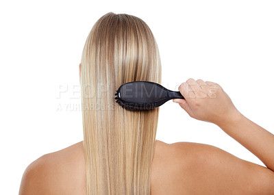 Buy stock photo Woman, back and brushing hair for grooming, texture or salon treatment on a white studio background. Rear view of female person, model or blonde with brush for haircare, keratin or shine on mockup