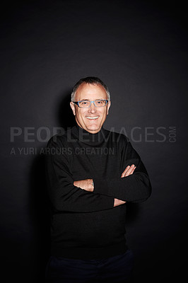 Buy stock photo Portrait of mature man in studio with smile, arms crossed and happy with dark fashion style. Pride, relax and senior person isolated on black background with expert knowledge, glasses and wisdom.