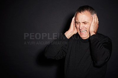 Buy stock photo Frustrated mature man in studio with stress, anxiety and dark fashion style on mockup space. Anger, fear and senior person isolated on black background with headache, mind and mental health burnout