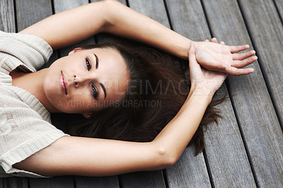Buy stock photo Woman, face and happy on porch for relax outdoor in backyard with break, lying down and rest in home. Person, portrait and smile on wooden deck in garden of house or apartment with carefree or casual