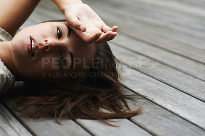 Buy stock photo Woman, portrait and confident on porch for relax outdoor in backyard and break, lying down and rest in home. Person, face or calm on wooden deck in garden of house or apartment and carefree or casual