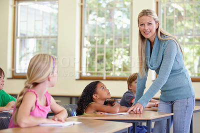 Buy stock photo Woman, portrait and happy teacher in classroom helping students in class. Teaching, female educator and smile of person with children learning in primary school for education, studying or knowledge.