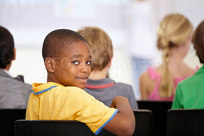 Buy stock photo Portrait, black boy or student in classroom for knowledge, education or development for future growth. Scholarship, back to school or happy child in chair for studying, listening or learning at desk 